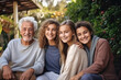 © Anoo - Big family together. Family photo of joyful children and old people. Children and grandchildren visit elderly parents. Family traditions and values. Friendly family. Caring for the elderly.