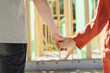 © Westend61 - Couple holding hands at construction site