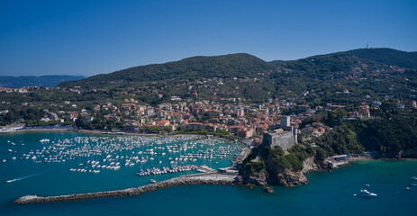 Wall Mural - Italian resorts on the Ligurian coast aerial view. Cityscape of Lerici Tourist resorts on the coast of the Gulf of La Spezia, Mediterranean sea, Liguria, Italy. Aerial panorama of the city of Lerici.