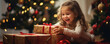 © Filip - Happy cute girl is surprised in opening his christmas presents.  Merry Christmas concept.