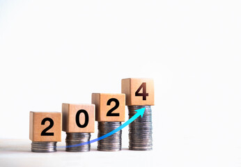 Wall Mural - Happy new year 2024, business growth and success, investment, profit, savings money concept. Rise arrow at 2024 number on wood cube blocks on coin stacks as graph step isolated on white background.