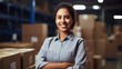 © AdriFerrer - Hispanic female factory worker posing with arms crossed