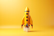 Yellow space shuttle or rocket on yellow background. Minimalism, conceptual pop, fresh idea or startup