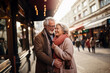 © uv_group - Senior couple are smiling for the camera while standing in front of the europian city