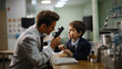© AS Photo Family - Little boy and his doctor in a medical office looking through a microscope.