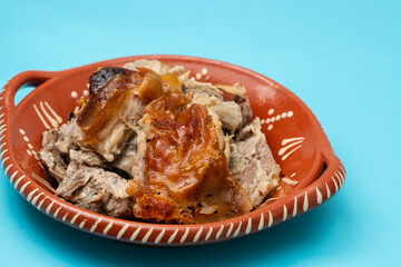 Poster - crispy tasty baked piglet in ceramic dish