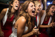 © forenna - fun and candid photo of the bride and her friends belting out tunes at a karaoke bar, showcasing their bond and enthusiasm. Photo