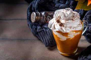 Wall Mural - Pumpkin spice latte in a glass cup