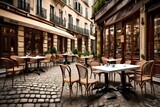Fototapeta  - Generate an image of a classic French cafe with bistro chairs and a small table on a cobblestone street 