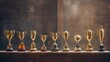 A row of trophies of varying sizes and designs