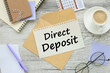 direct deposit . Business concept image. calendar on the table. paper with text on the envelope.