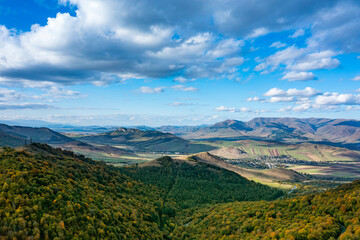 Aerial landscape of winding road in the forest serpentine view mountains with autumn forest