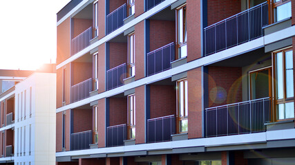 Wall Mural - Brand new apartment building on sunny day. Modern residential architecture. Modern multi-family apartment house. 