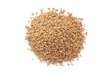 Pile of organic Wheat Grains (Triticum) or caryopsis fruits isolated on a white background. Top view