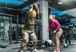 Two plus-size women workout and exercise with medicine ball at the gym. They're determined to achieve their goals and inspire others along the way.	