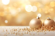© Dri Barros - Duas bolas de natal douradas em uma superficie decorada com fundo de luzes