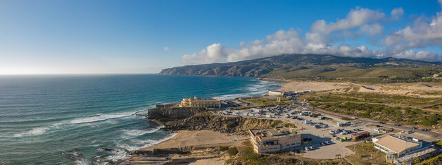 Wall Mural - rocky and sandy coastlines of portugal ocean coast. aerial view of guincho beach.