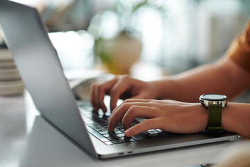 Wall Mural - Closeup image of student working on laptop at home