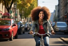 Positive black woman riding electric bicycle on city street
