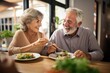 Food, retirement and a senior couple in an assisted living home while eating a meal for nutrition. Cute, love or smile with a happy elderly man feeding his wife in the dining room of a house