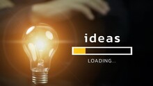 Glowing Lightbulbs With Loading The Idea. Innovation Idea To Success, Business Innovative Solution, Help Company Achieve Goal Concept, Smart Lightbulb Innovation Idea.