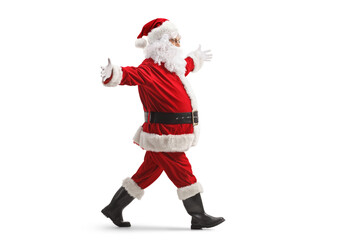 Sticker - Full length profile shot of santa claus walking with arms wide open