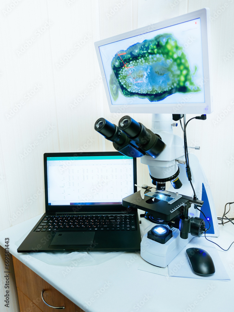 Modern digital microscope equipped with camera, computer in laboratory ...