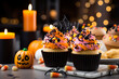Cupcake on Halloween party. Muffin desserts decorated with colored sprinkles