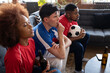 © ReeldealHD images - Friends watching a football match at home
