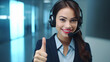 Telemarketing attractive business woman, brunette hair, smiling and showing ok sign. Close-up.