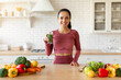 © Prostock-studio - Fit woman enjoying freshly made smoothie in her cozy kitchen