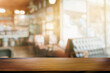 © JK_kyoto - Wooden board empty table blurred cafe background.