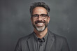 © AzherJawed - Smiling Mature Man with Glasses on Gray Background