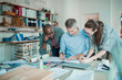 © Geber86 - Group of people working together on a project in a startup company office