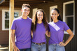 © Tixel - Portrait of diverse group of confident volunteers building  charity home