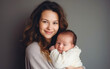 © piai - Pretty woman mom holding her newborn baby