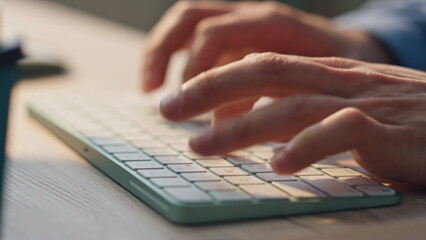 Wall Mural - man fingers texting keyboard working computer closeup. freelancer hands typing