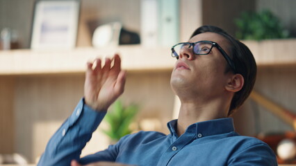 Wall Mural - Closeup businessman tossing ball at office. Relaxed freelancer taking work break