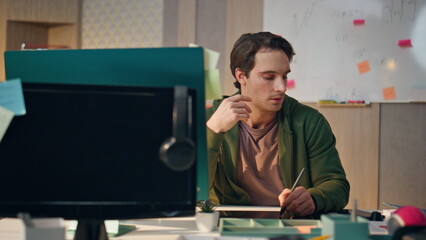 Wall Mural - Serious artist answering phone call workplace closeup. Designer drawing tablet