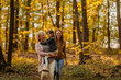 © bernardbodo - Mother, daughter and grandmother walking in the forest during autumn