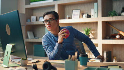 Wall Mural - Thoughtful startuper staring computer screen at office. Freelancer man working