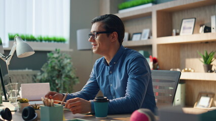 Wall Mural - Startup guy video calling at room closeup. Man talking computer virtual meeting