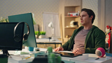 Wall Mural - Exhausted artist rubbing neck at office close up. Designer man feeling headache