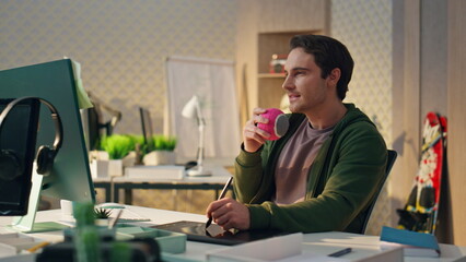 Wall Mural - Creative artist staring computer screen modern office. Smiling man having idea