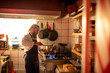 © Marko Geber - Young sushi chef boiling water for the rice for a sushi meal in the kitchen of sushi restaurant