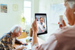 © Marko Geber - Senior Caucasian woman consulting her doctor about medication on a video call at home