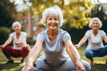Sporty Senior Women Doing Exercise In Garden During Group Training - Mature Female Exercising Hands And Knees Balance Outside - Healthy Life Style