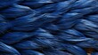 A tapestry of blue fibers twirls and weaves together to form an exquisite composition of feathers, creating a captivating scene of wild beauty
