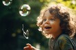 A delightful image of a little girl having fun while playing with soap bubbles. 