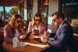 © Ева Поликарпова - A group of people gathered around a table, using a tablet device. This versatile image can be used to represent teamwork, collaboration, or technology in various settings.